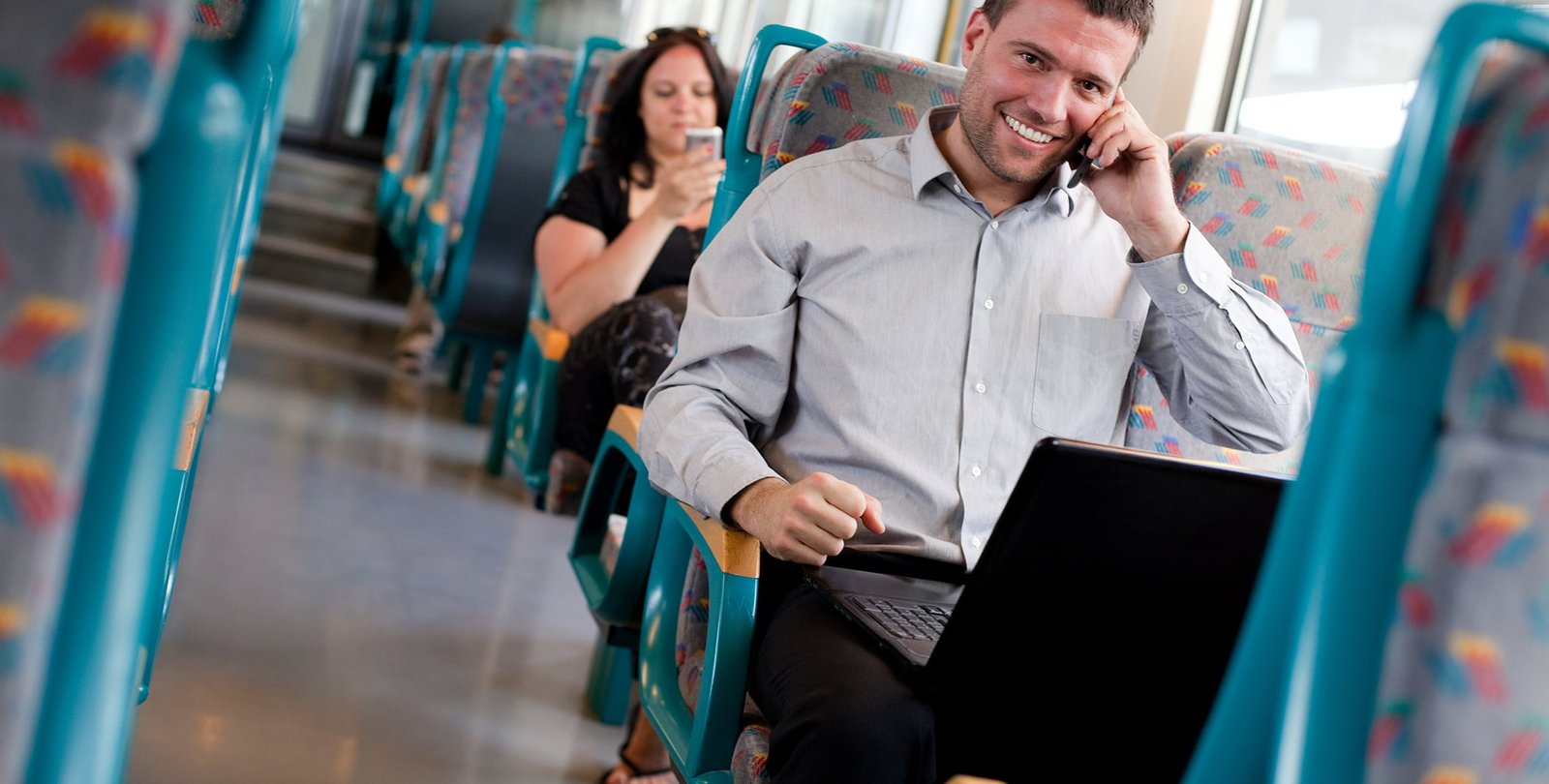 Handsome businessman working on the train